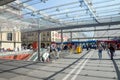 Bern, Switzerland - August 14 2019: People walking under the roof by tram station. The station is adjacent to the main train Royalty Free Stock Photo