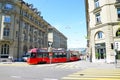 Bern, Switzerland - August 14 2019: Red tram in the city center of the Swiss capital. Red light on zebra crossing, city crossroad