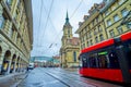 Modern tram rides along Spitalgasse street to Bubenbergplatz in Altstadt district in Bern, Switzerland