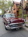 Old red 1957 Chevrolet Chevy Bel Air sport sedan two door parked in the street. Iconic classic car. Royalty Free Stock Photo