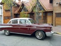 Old red 1957 Chevrolet Chevy Bel Air sport sedan two door parked in the street. Iconic classic car. Royalty Free Stock Photo