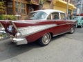 Old red 1957 Chevrolet Chevy Bel Air sport sedan two door parked in the street. Iconic classic car. Royalty Free Stock Photo