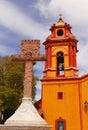 Cross and Church in PeÃÂ±a de Bernal queretaro mexico XI Royalty Free Stock Photo