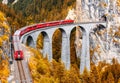 Bernina express glacier train on Landwasser Viaduct in autumn, Switzerland