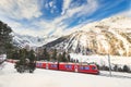 Bernina tourist red train pass on the Swiss Alps