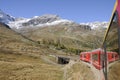 The Bernina train crossing the swiss alps in the upper Engadin