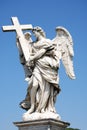 Bernini marble statue of angel with cross from the Sant Angelo Bridge in Rome Royalty Free Stock Photo