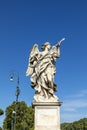 Bernini`s marble statue of angel with cross from the Sant`Angelo Bridge in Rome Royalty Free Stock Photo