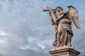 Bernini`s marble statue of angel with cross from the Sant`Angelo Bridge in Rome, Italy Royalty Free Stock Photo