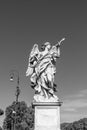 Bernini`s marble statue of angel with cross from the Sant`Angelo Bridge in Rome Royalty Free Stock Photo