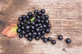 Berries is black currant on a wooden table. Royalty Free Stock Photo