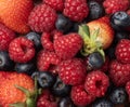 Berries closeup backdrop. Strawberry, raspberry and bluberry