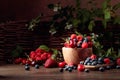 Berries closeup colorful assorted mix of strawberry, blueberry, raspberry and sweet cherry on a old wooden table Royalty Free Stock Photo