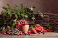 Berries closeup colorful assorted mix of strawberry, blueberry, raspberry and sweet cherry on a old wooden table Royalty Free Stock Photo