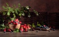 Berries closeup colorful assorted mix of strawberry, blueberry, raspberry and sweet cherry on a old wooden table Royalty Free Stock Photo