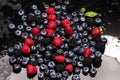 Berries closeup. Mix of blueberry, raspberry, red currant. Fresh berries as background. Texture of fresh berries. Berry Royalty Free Stock Photo
