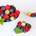 Berries fruits berry fruit strawberries strawberry blueberries blueberry square in a bowl Royalty Free Stock Photo