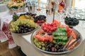 Berries and fruits in a glass dish and a tray on banquet table Royalty Free Stock Photo