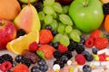 Berries, fruits, vitamins and nutritional supplements Royalty Free Stock Photo