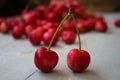 Berries of light cherry on a wooden background