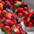 Berries in plastic baskets. Fresh strawberries, raspberries, blackberries, blueberries in takeaway cups. market. close-up Royalty Free Stock Photo