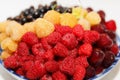 Berries plate, ripe fresh assorted, white and red raspberries, cherries, and currants