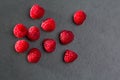 Berries raspberry on black slate background