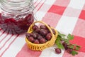 berries of a red gooseberry and jam Royalty Free Stock Photo