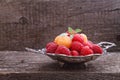 Berries red and yellow raspberries in a metal bowl Royalty Free Stock Photo