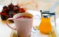 berries tea mug with honey and a teaspoon on a tray and decoration Royalty Free Stock Photo