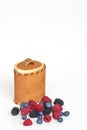 Berries variation and birch bark basket on a white background