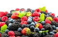 Berries. Various colorful berries background. Mint leaves, Strawberry, Raspberry, Blackberry, Blueberry close-up backdrop