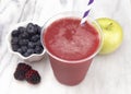 Berry and Apple Smoothie in a Plastic Disposable Cup
