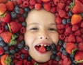 Berry banner. Mix of berries. Kids face with fresh berries fruits. Assorted mix of berries strawberry, blueberry Royalty Free Stock Photo