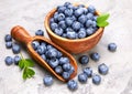 Berry blueberry in wooden dish with scoop Royalty Free Stock Photo