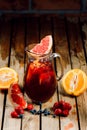 berry citrus punch lemonade with grapefruit, orange, strawberries and blueberries in a jug