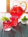 Berry compote decanter glasses with apple slices on wooden rustic background solar.