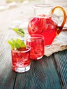 Berry compote decanter glasses with apple slices on wooden rustic background solar.