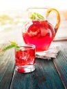 Berry compote decanter glasses with apple slices on wooden rustic background solar.