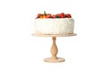 Berry cream cake on wooden stand isolated on background