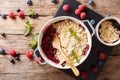 Berry crumble with currants, raspberries and blueberries decorated with mint close up.  Horizontal top view Royalty Free Stock Photo