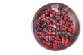 berry Elaeagnus multiflora, gumi, blackberry frozen, isolate on white, in metal bowl close up, ice