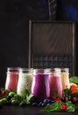 Berry fruit cokctalis, smoothies and milkshakes, fresh fruit and berries on brown table, still life, selective focus