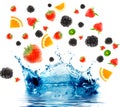 Berry and fruit falling in juice. Royalty Free Stock Photo