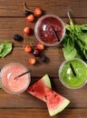 Berry fruit and spinach drink smoothies with cherries, raspberry and watermelon