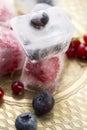 Berry fruits frozen in ice cubes Royalty Free Stock Photo