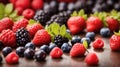 Berry fruits like strawberries, blueberries, red currants, raspberries and blackberries in a row