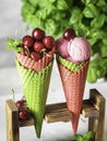 Berry ice cream in a waffle cone on a light background. Cherry ice cream. Ice cream cone with cherry, sweet cherry Royalty Free Stock Photo