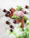 Berry ice cream in a waffle cone on a light background. Cherry ice cream. Ice cream cone with cherry, sweet cherry Royalty Free Stock Photo