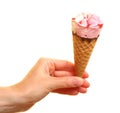 Berry icecream cone in hand on white